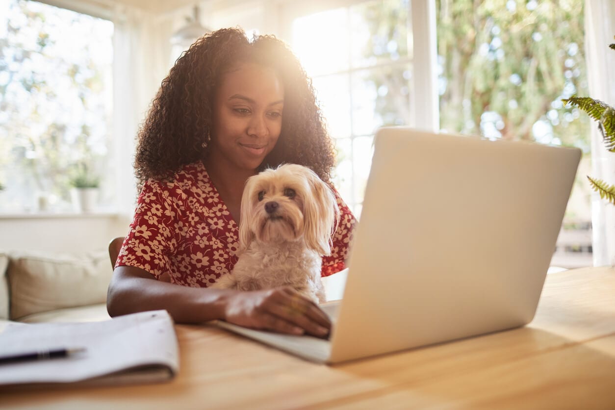 woman with dog and laptop