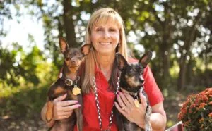 Doctor Holding Dogs Outside